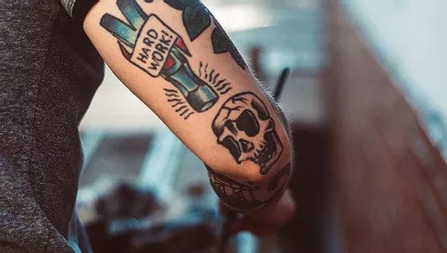 Arm with tattoos